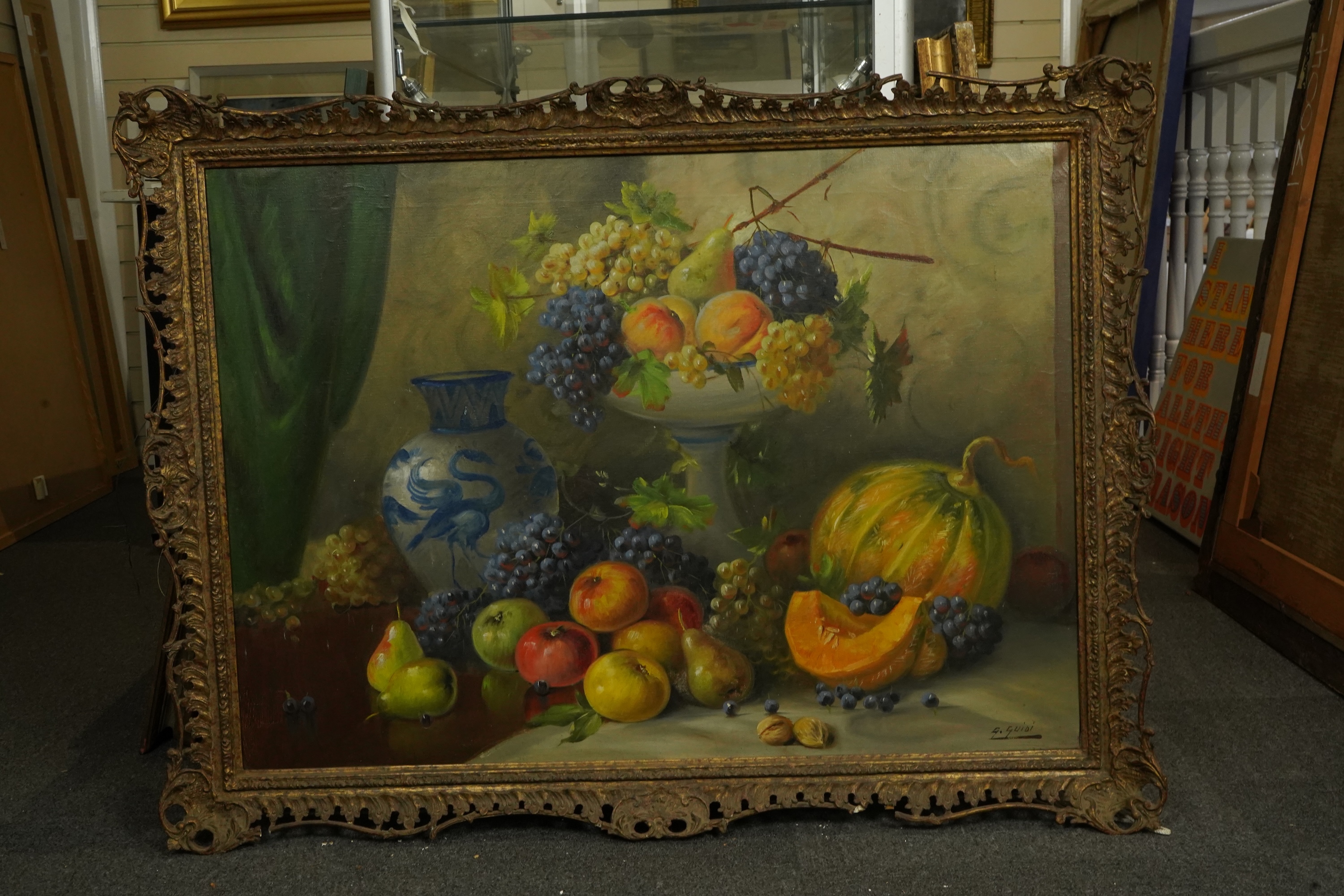 G. Guidi, Still life with a melon, grapes, pears, apples and walnuts, oil on canvas, 67 x 94cm